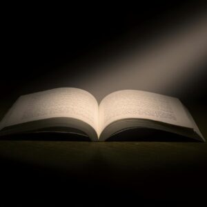 A captivating image of an open book under a dramatic spotlight, symbolizing knowledge.